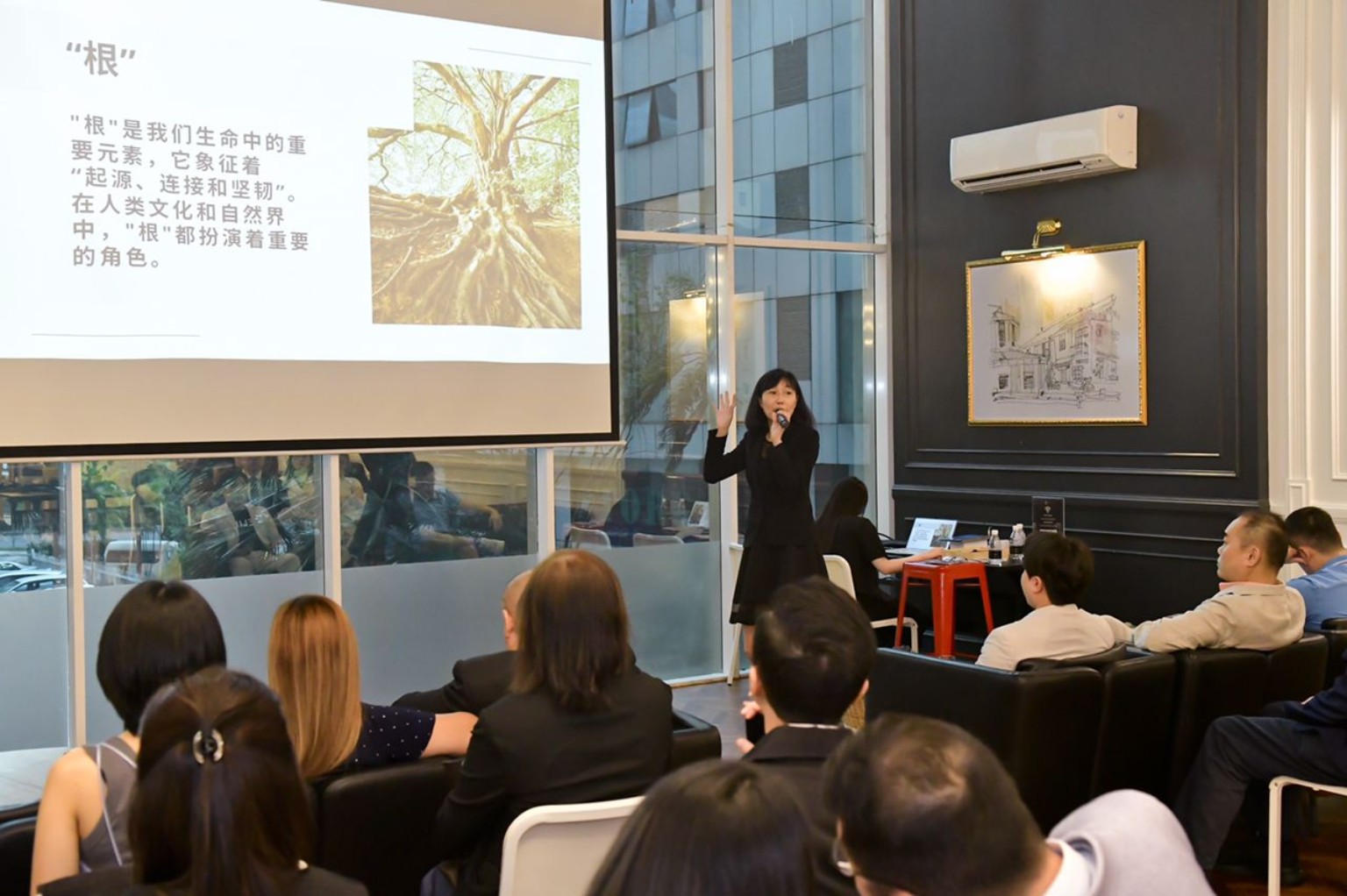 Speaker sharing ideas with participants at an indoor learning session